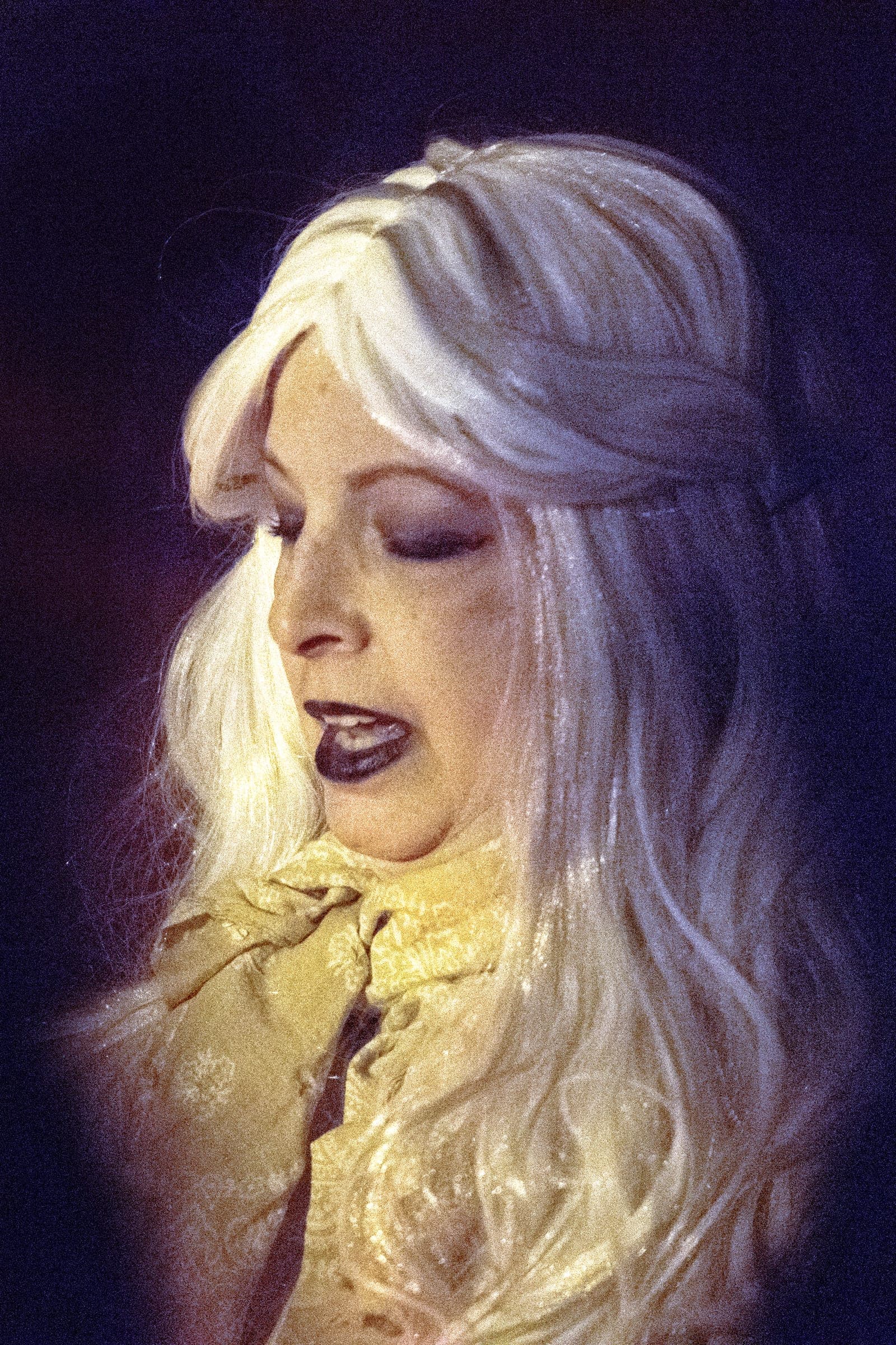 A ghostly Creepy Crawl character in a white wig and a gold Victorian gown